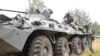 A Wagner fighter and a Belarusian service member take part in a joint training at the Brest military range outside Brest, Belarus,