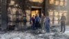 In this grab taken from a handout footage on June 24, 2024, Dagestan region governor Sergei Melikov visits a burned out synagogue, which was attacked by gunmen, in Derbent. (AFP photo / administration of the head of Russia's Dagestan Republic) 