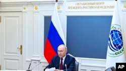 Russian President Vladimir Putin attends a meeting of the Shanghai Cooperation Organization Heads of State Council via videoconference at the Kremlin, in Moscow, Russia, July 4, 2023. (Alexander Kazakov, Sputnik, Kremlin Pool Photo via AP)