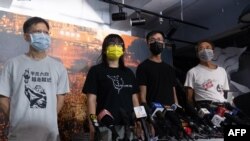 FILE - The Hong Kong Alliance in Support of Patriotic Democratic Movements of China standing committee members, from left, Tang Ngok-kwan, Chow Hang-tung, Simon Leung Kam-wai and Tsui Hon-kwong attend a press conference in Hong Kong on Sept. 5, 2021.