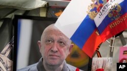 A portrait of the owner of private military company Wagner Group Yevgeny Prigozhin lays at an informal street memorial near the Kremlin in Moscow, Russia, Aug. 26, 2023. 