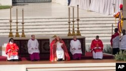 Pope Francis, center, celebrates the Palm Sunday's mass in St. Peter's Square at The Vatican, April 2, 2023. 