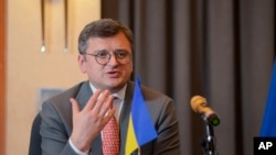 Ukrainian Foreign Minister Dmytro Kuleba speaks at a press conference at a hotel in Addis Ababa, Ethiopia Wednesday, May 24, 2023. Kuleba urged African countries to abandon their stances of neutrality towards his country's war with Russia.