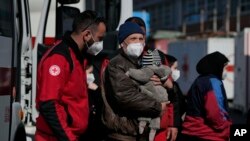 Refugees from Lviv, Ukraine, arrive at a Red Cross headquarters in Rome, March 22, 2022.