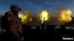 Ukrainian members of the military fire an anti-aircraft weapon in the frontline city of Bakhmut, as Russia's attack on Ukraine continues, Jan. 10, 2023. 