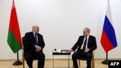 Russia's President Vladimir Putin speaks with Belarus President Alexander Lukashenko during their talks at the engineering building of the technical complex of the Soyuz-2 space rocket complex at the Vostochny Cosmodrome, some 180 km north of Blagoveschen