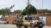 A patrol of the Niger national Police drives past the French Embassy in Niamey on August 28, 2023.