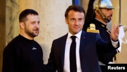 French President Emmanuel Macron meets with Ukraine's President Volodymyr Zelenskiy, in Paris