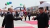 In this pool photograph distributed by the Russian state agency Sputnik, North Korea's leader Kim Jong Un (R) shakes hands with Russian President Vladimir Putin during a welcoming ceremony at Kim Il Sung Square in Pyongyang on June 19, 2024.