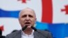 FILE - Vano Merabishvili, leader of opposition United National Movement party, addresses people during a rally in Tbilisi.