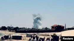 Smoke rises following Israeli strikes, in Rafah